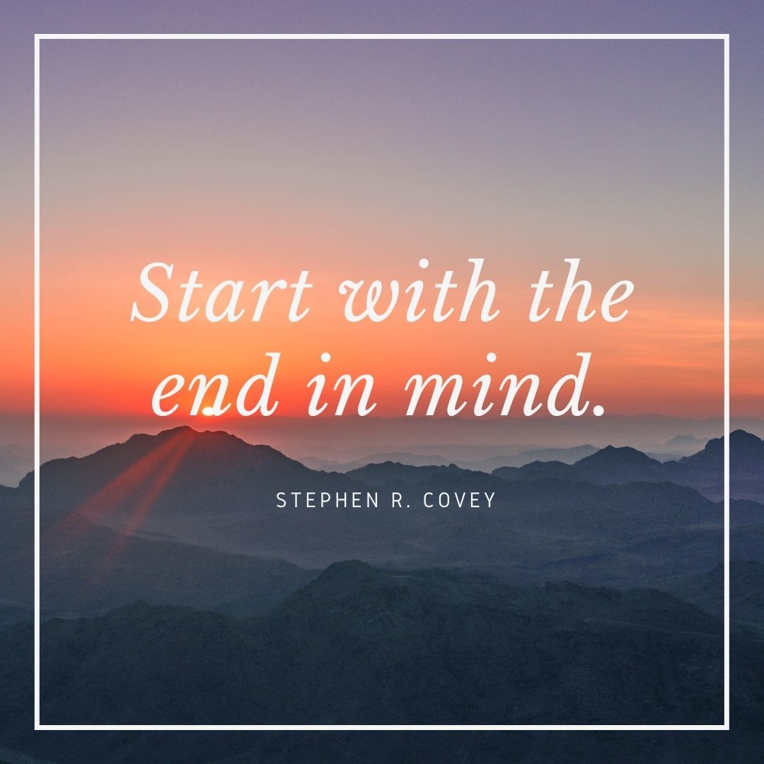 Stephen Covey quote over a mountain sunrise, reinforcing goal-focused business planning from a leadership lens.