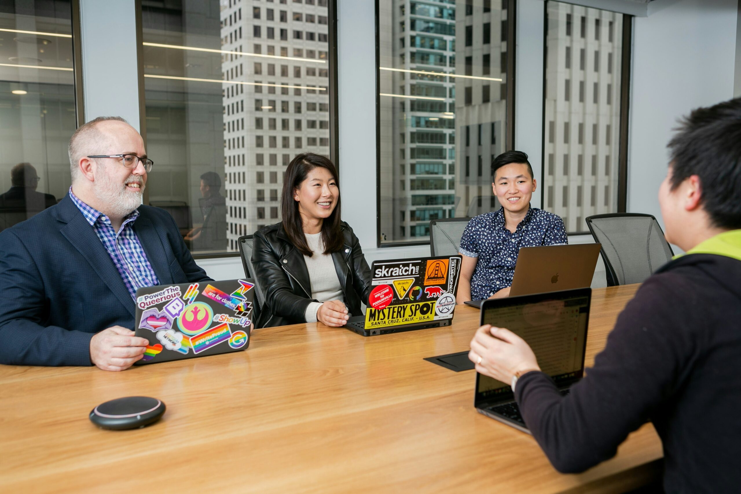 Sales leaders in a boardroom discussion, collaborating to lead teams in today’s fast-changing business world.