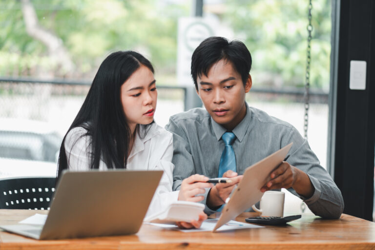 Sales coaching in action with a coach and sales professional discussing real field lessons