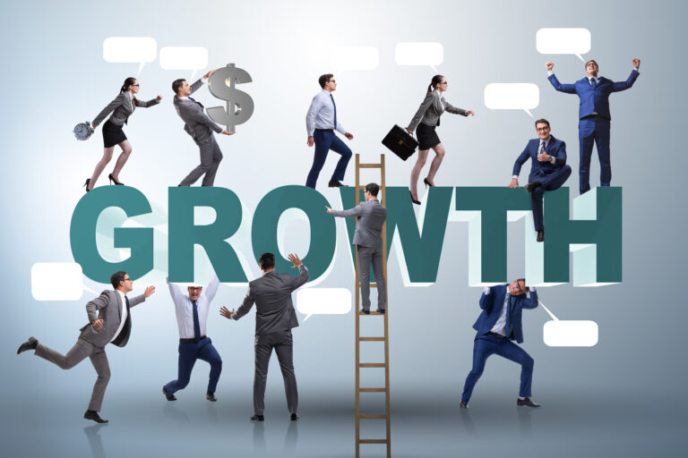 Business professionals navigating different challenges while climbing around the word “growth,” symbolising the complexity of sales performance, leadership development, and capability building.